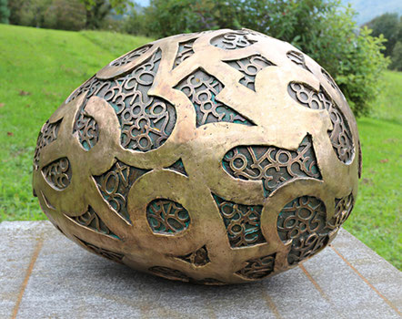 Big Egg, bronze sculpture with perforated numbers by Paolo Grassi, part of the project From "0" to Infinity