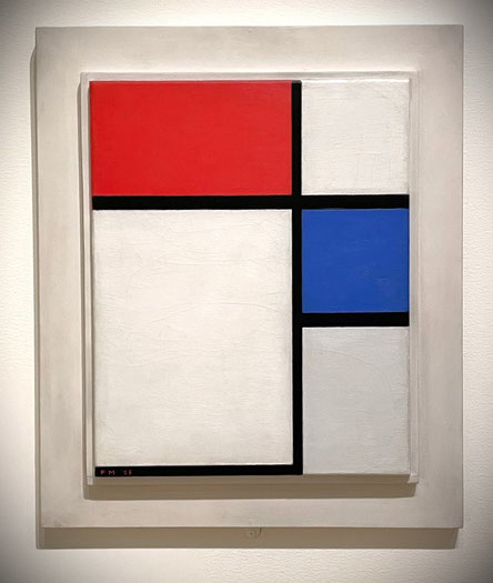 Painting by Piet Mondrian with red and blue square. Tate Modern, London