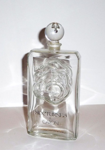 1981  : NOCTURNES - PARFUM DE TOILETTE 200 ML - BOUCHON BOULE EN VERRE - FLACON DESSINE PAR PIERRE DINAND