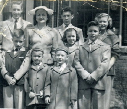 Grandma with her eight children in front of the house in Pittsburgh, PA