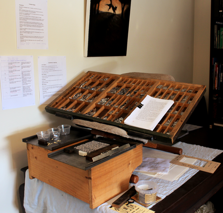 My first typesetting rig: an old cupboard coupled with an ergonomic chair