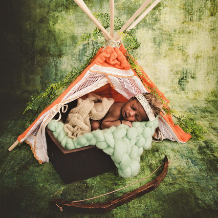 newborn in tent