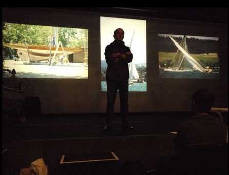 A slide of yachts during Geller's talk.
