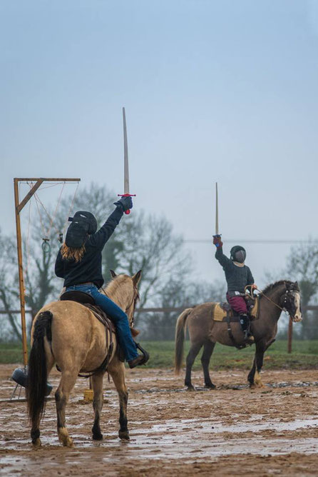 The Horsemen during a mounted combat demo