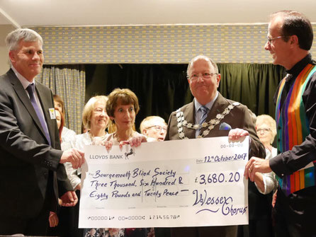 Mayor of Bournemouth handing a cheque to the Bournemouth Blind Society.