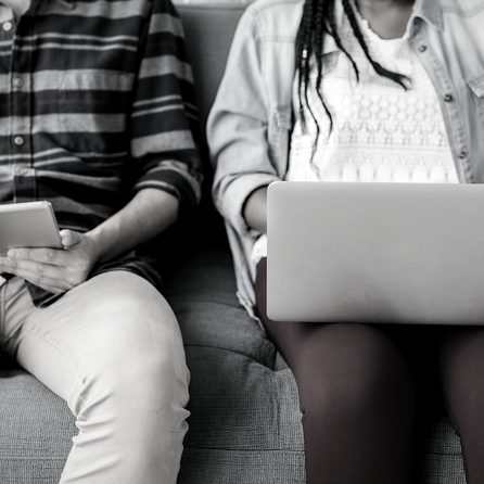 Two students in front of laptops