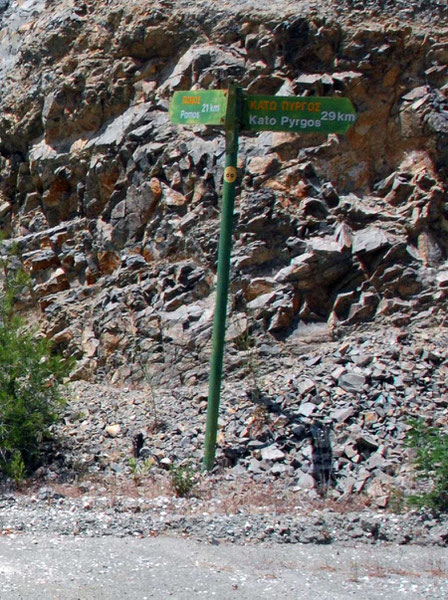 The sign at the top of the Pomos dirt road showing 21km to Pomos