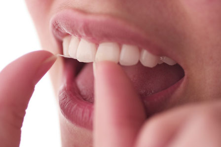 food stuck in teeth