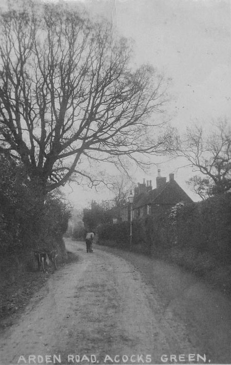 Arden Road as a narrow lane in Victorian times, with the famous tree and the old cottages, now listed