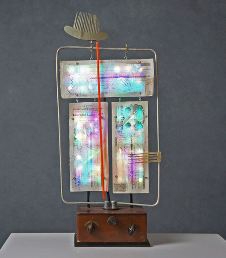 Assemblage light art sculpture made from an old glass washboard. This sculpture acts almost as a "light painting" with plexiglass, lenticular plastic, and LEDs placed in back.  The glass which refracts the light and the appearance of these components.