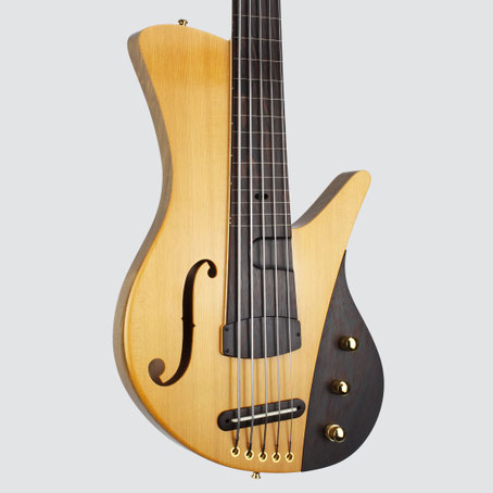 Ulrich presents their new fretless semi-hollow bass with a wooden bridge, Amati style f hole and spruce walnut body