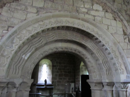 The patterned late-12th-century arch is set inside an earlier mid-12th-century arch visible in the top right and left of the photograph.