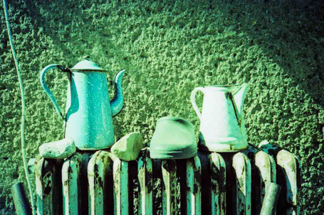 Still live with pots at the wall.
