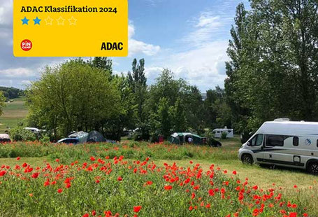 Naturcamping 2026 Naturcampingplatz Alt Reddevitz Wohnmobile auf Blumenwiese