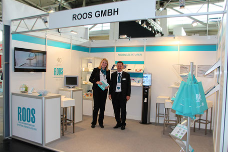 Das Roos Team auf seinem Stand bei der Messe Inprint