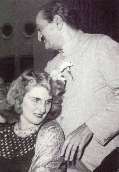 Meher Baba with Virginia Rudd at Longchamps Restaurant, Manhattan - 22nd July 1956 ; Image taken from VHS cover "Memories of Meher Baba".