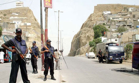 Police commandos patrol Karachi’s low-income Kati Pahari (Split Mountain) area. One side of the hill is populated by Mohajirs and the other by Pakhtuns. Photo: Dawn.com 2015