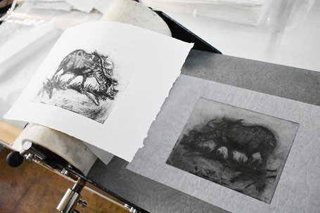 An inked acrylic plate (right) and finished print (left)