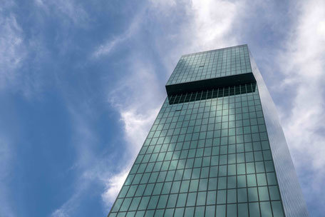 View up the glass Prime Tower to the blue sky