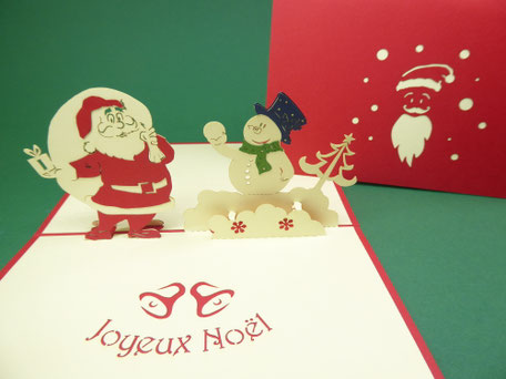 carte pop-up joyeux noël avec le père no<êl et un bonhomme de neige