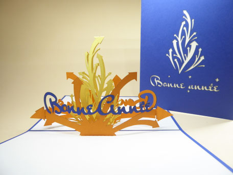 carte pop-up bonne année orange jaune et bleue
