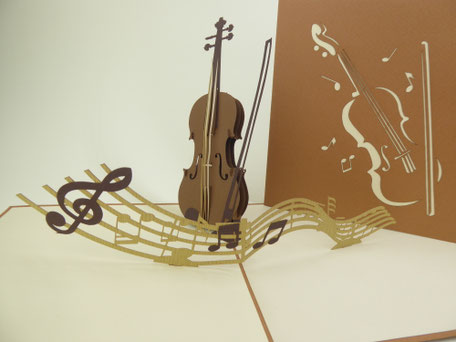 Carte pop-up violon, archet et partition musicale