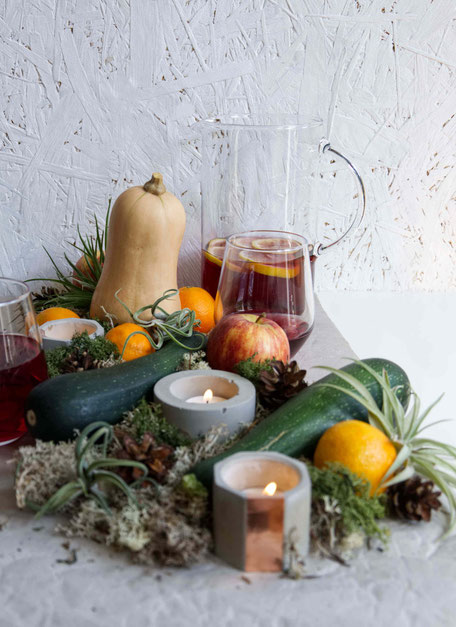 Autumn centrepiece with Air Plants, fresh produce, moss and concrete candle holders By PASiNGA Blog