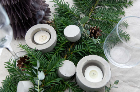 Modern Table Settings For Christmas With Evergreens And Concrete Accents By PASiNGA