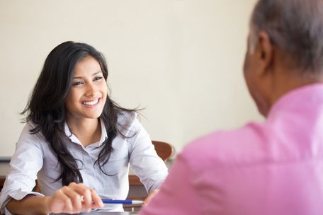 A holistic lifestyle coach helping her male indian client effectively deal with his insomnia issue