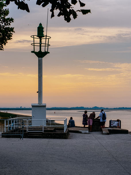Mini lighthouse at sunset