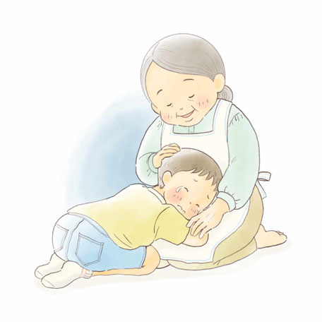 おばあちゃんの膝で泣いている少年