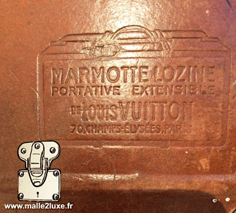 Marquage lozine valise Louis Vuitton : Marmotte lozine Portative extensible de Louis Vuitton 70, champs-Elysées, Paris