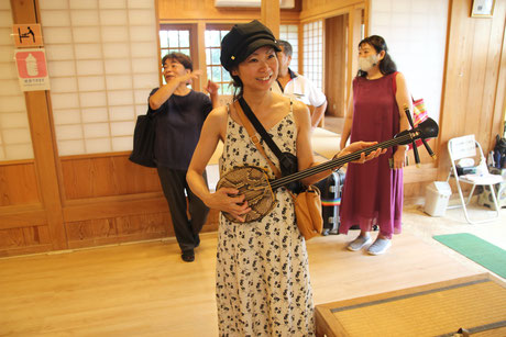 Learn how to play the sanshin from a local.