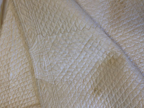 C18th quilted bedgown, showing mending. BATMC 97.18 (loan)