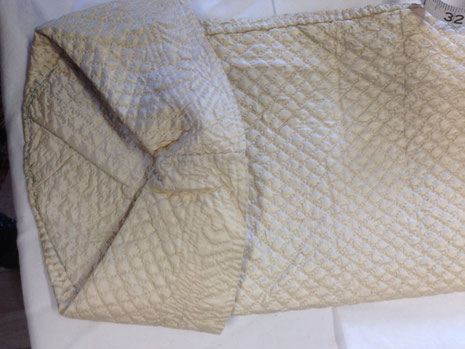 C18th quilted bedgown, showing inner elbow view of cuff. BATMC 97.18 (loan)