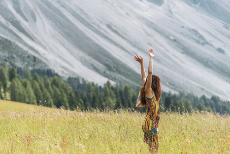 Irene infront of the Geisler, part of the Dolomites in South Tyrol, Italy