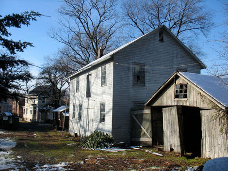 Dilapidated barn before construction.