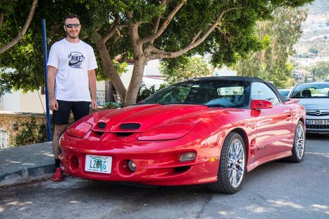 Yunus with sportscar picked us up