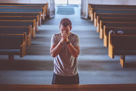 Nervous man praying