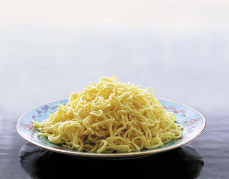 yellow mee on a plate