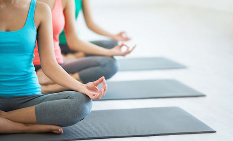 Asian women practicing yoga