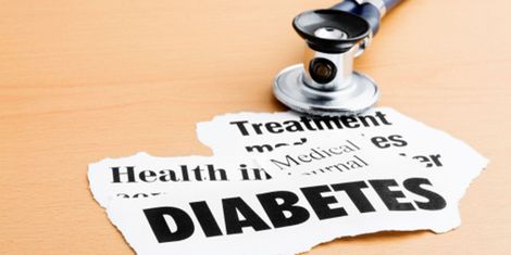 A conceptual picture of the medical community and diabetes, diabetes text and stethoscope are placed on a beige table