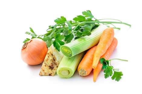 Mirepoix. Ingredients for vegetable broth, carrots, onion, leeks, celery, parsley on white background