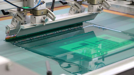 Screen printing of flexible silver circuits.