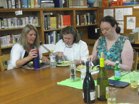 Eating at the table. From left, Debbie Timon, Maggi Suttles and Librarian Justine Rogers.  Photo by Marilou Blaine