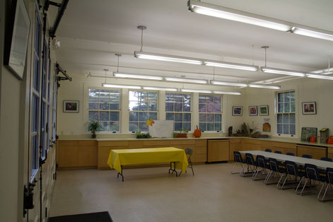 View of new education center with original doors and new cabinets and windows. 