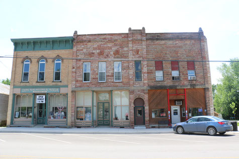 A photo of three historic buildings in Lyons, Michigan.