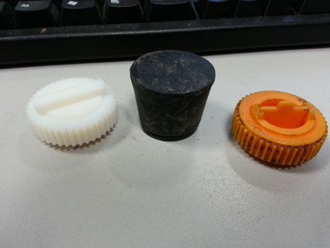 From right: Broken oil cap. Temporary substitute for said cap. (any bung in a storm) and finally, on the far left is the 3D printed replacement cap.