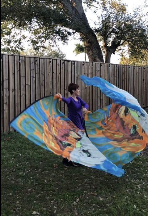 Image is 1/2 Eagle face and 1/2 Lion face on silk flags.