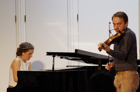 Oisin MacDiarmada and Samantha Harvey performing at a concert in Tokyo